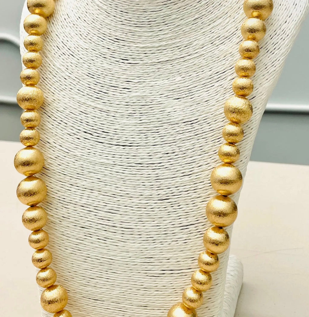 Long gold necklace