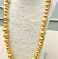 Long gold necklace