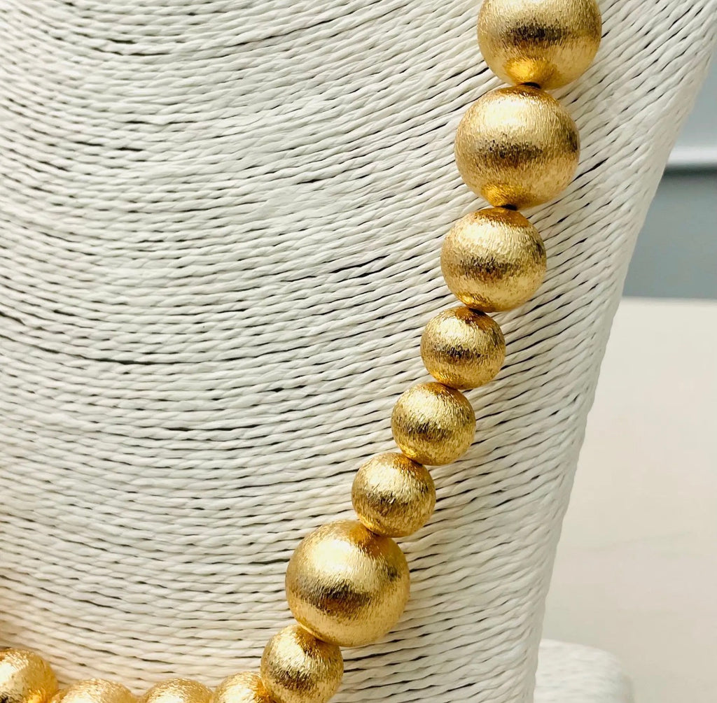 Long gold necklace